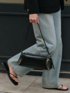 Handbags- The shape of the bag are long, rectangular handbags that stretch sideways.